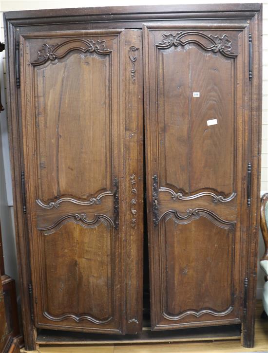 A late 18th century French oak two door armoire, 197cm high